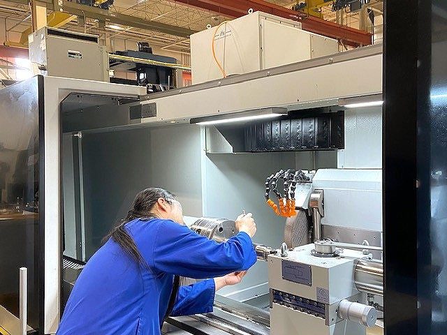 LHM Technologies Employee working on the production floor